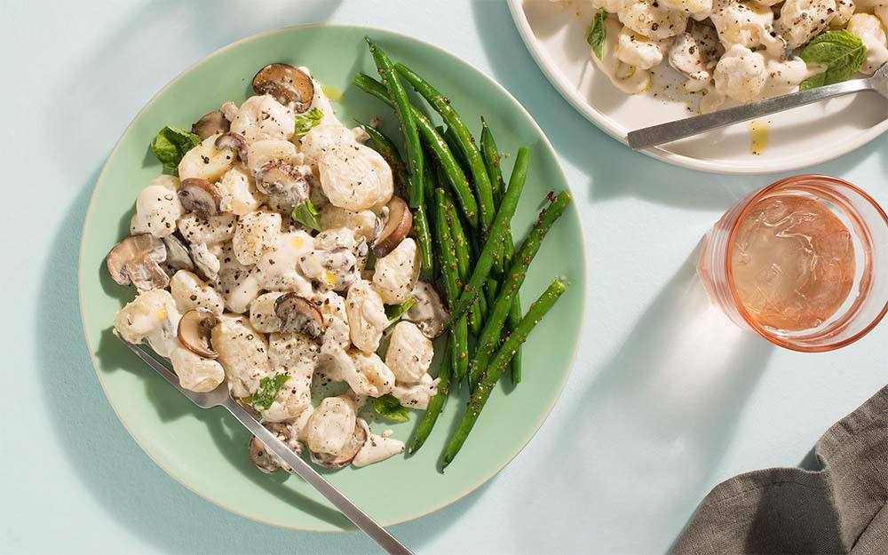 Roasted Garlic Gnocchi with a creamy mushroom sauce & honey Dijon green beans,
